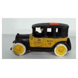 Cast iron yellow cab with driver made by ARCADE.