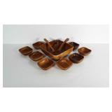 Wooden salad bowl with serving spoons and 8