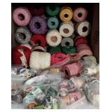 Knitting thread and a few dozen spools of sewing