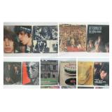 Twelve ROLLING STONES albums with covers.