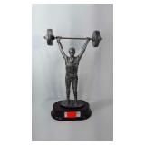 Power lifting figure. Measures 11" tall.