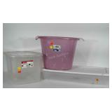 3 storage containers: pink tub has crack in