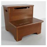 Wooden step stool with hidden storage in top step.