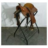 Youth saddle with stand, some damage to leather