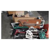 Skid lot, brooms, birdhouse, media storage, car