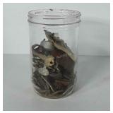 7" glass jar full of keys, locks, and screws