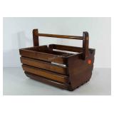 Wooden basket style magazine holder.