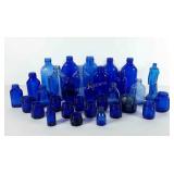 Blue glass bottles/jars, sizes vary from 1 1/2"-