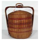 Stacked basket with handle. Stands 18" tall. Has