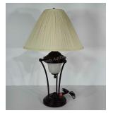 Table lamp. Stands 32" tall. Shade has a few