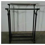 Double sided, rolling garment rack. Adjustable