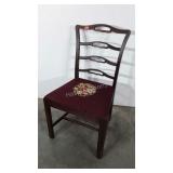 Single dining chair with needlepoint seat.