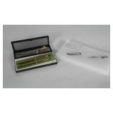 3 nice pens in cases and 2 tiny flashlights.