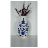 Ceramic vase with blue floral design. Measures