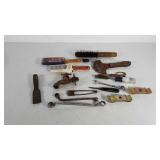 Tools, paint brushes, water spigot, chisel,