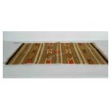 Woven throw rug. Measures 19x36 inches.
