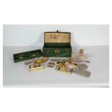 Metal toolbox with fishing gear: spinners,