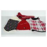 Dog clothes. One is labeled as a Medium and they