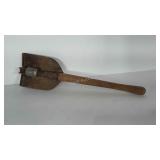 Trench shovel with wooden handle. Handle is 20 in