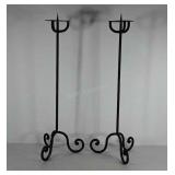 Pair of cast iron floor standing candle holders,