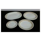 Eleven pieces of Corelle dishware with gold