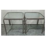 Two glass top patio tables. 20"×20"×19", each.