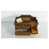 Dresser box with a few costume pieces and picture