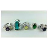 Five costume rings silvertone sizes 6 and 7