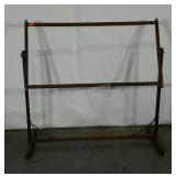 Adjustable frame for needlework. Frame holds up