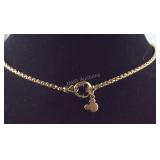 Goldtone necklace with Mickey Mouse design cutout