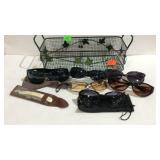 Wire baskets with sunglasses and a straight razor