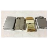 Four lighters one is Zippo