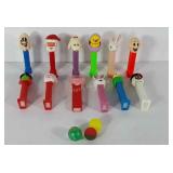 Twelve holiday themed pez dispensers and three
