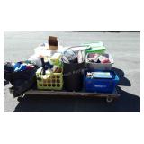 Totes filled with stuffed animals, grocery bags,