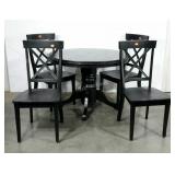 Black pedestal table and four chairs.