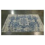 Small ivory and blue area rug. 47"×68". Seller