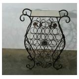 Metalwork free standing wine rack with tile top.