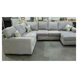 Three piece sectional sofa. Light grey, nice