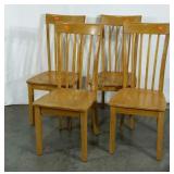 Set of four dining chairs, wood with high backs.