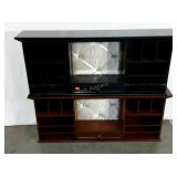 Two decorative shelving units, one wood and one