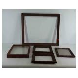 Group of wooden picture frames, sizes range from