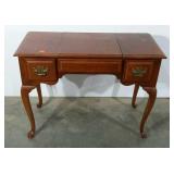 Stanley, flip-center vanity with Queen Anne legs.