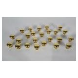 Approximately 2 dozen brass knobs. All matching.