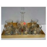 Six high ball glasses, a decanter and decorative