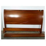 King size bed with sleigh style headboard.