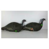 Two foam field decoys, turkey hens. One has some