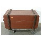 Rustic storage box with leather strap closures.