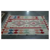 Woven rug with geometric native design. 47"×70".