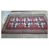 Woven rug with geometric native design in nice