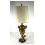 Urn shaped table lamp with shade, rams head